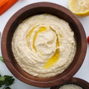 classic-hummus-recipe-inside-a-wooden-bowl