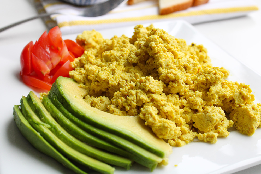 Tofu Scramble with tomatoes and avocado on a plate