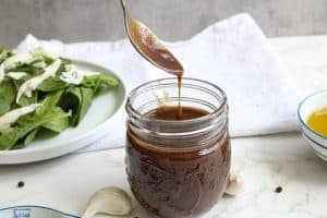 Balsamic Vinaigrette Recipe dripping off a spoon