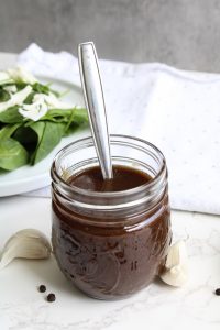 Balsamic Vinaigrette Recipe vertical view with a spoon