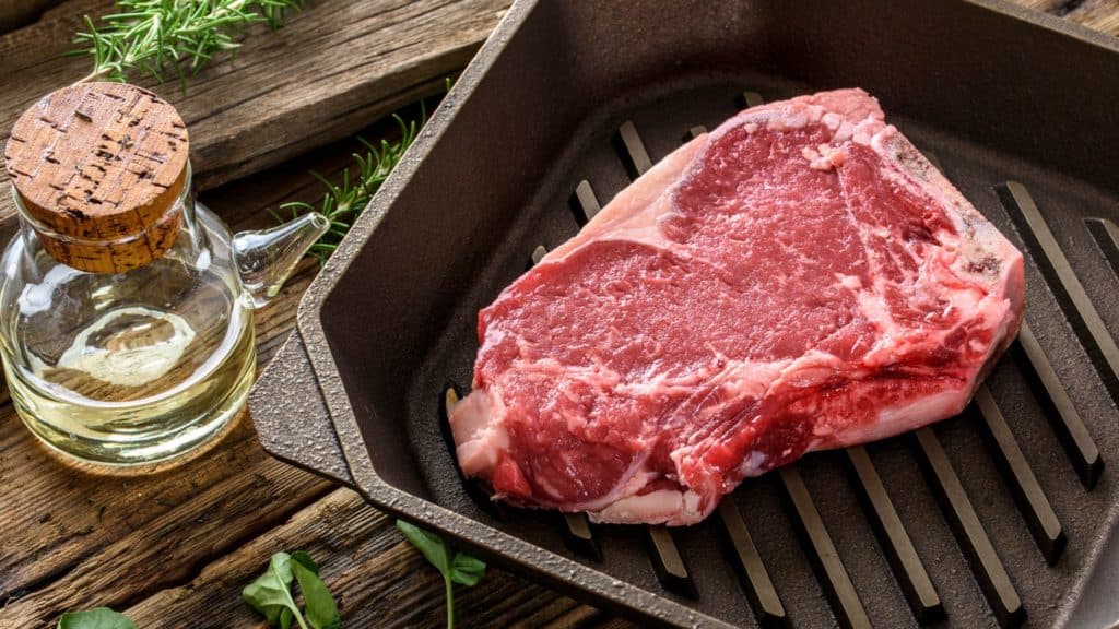 red steak on cast iron