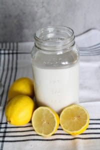 non-dairy-substitutes-for-buttermilk-vertical close-of-jar-and-lemon