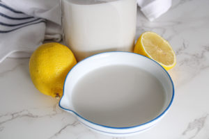 non dairy substitutes for buttermilk close up view of almond milk and lemons
