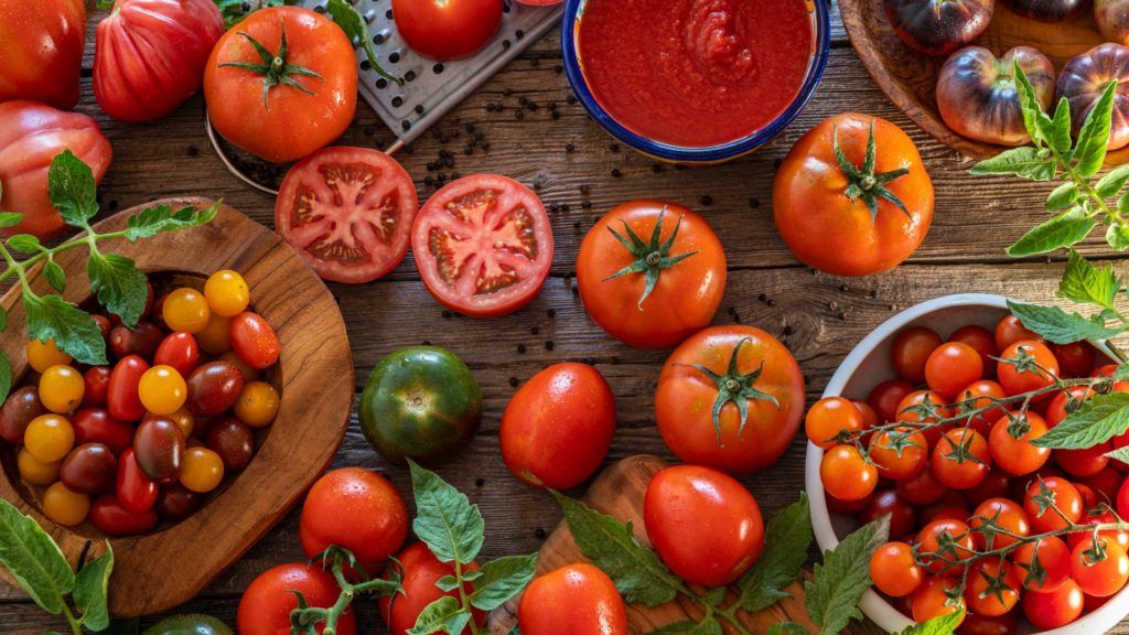 different types of tomatoes displayed on wooden table high volume low-calorie foods