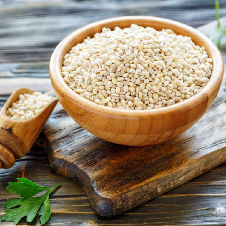 Barley grains in a wooden bowl
