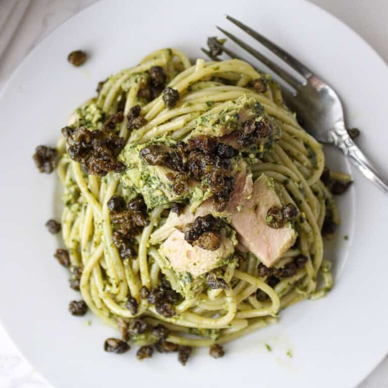 pesto pasta with tuna and capers on top